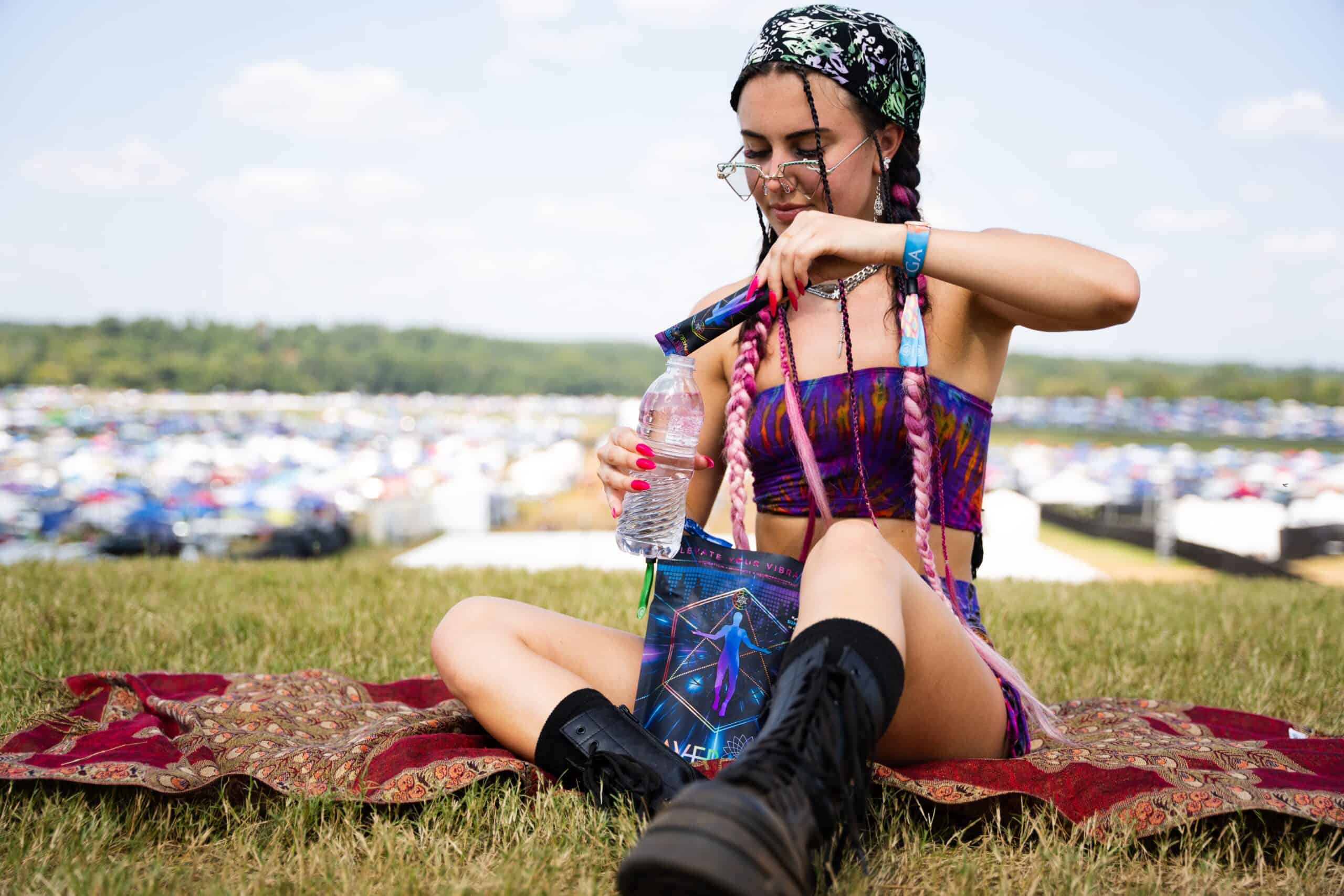 A girl wearing a dress and putting supplement