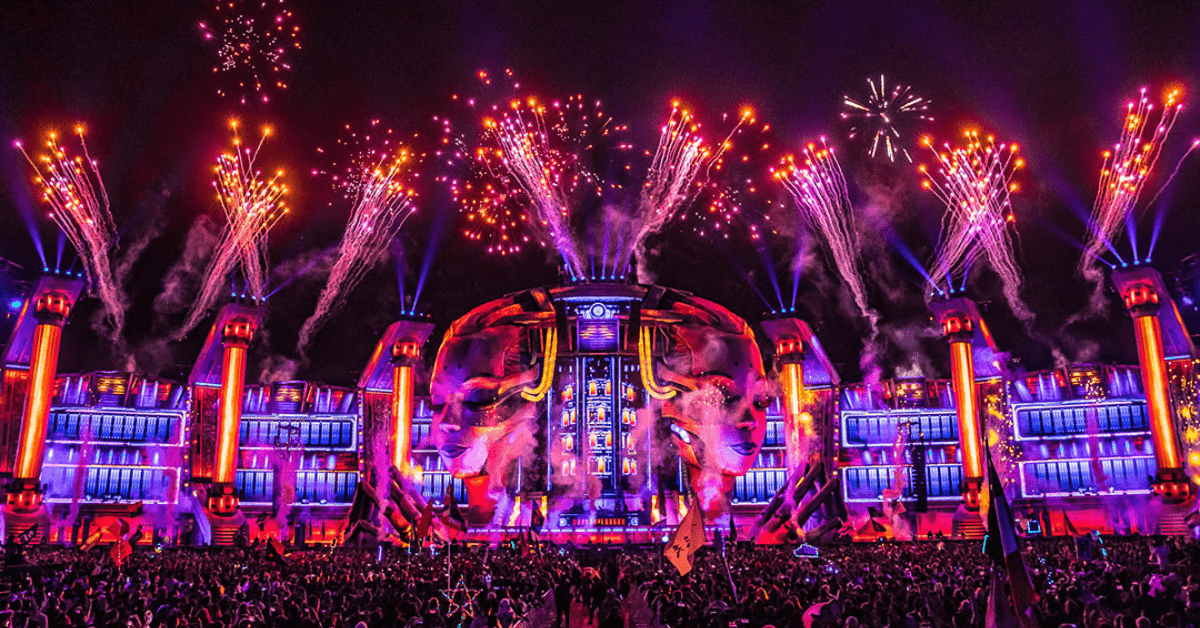 A large stage with fireworks and lights on it