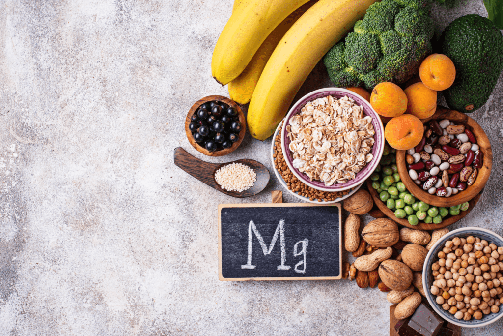 A table topped with fruits and nuts next to an mg sign.